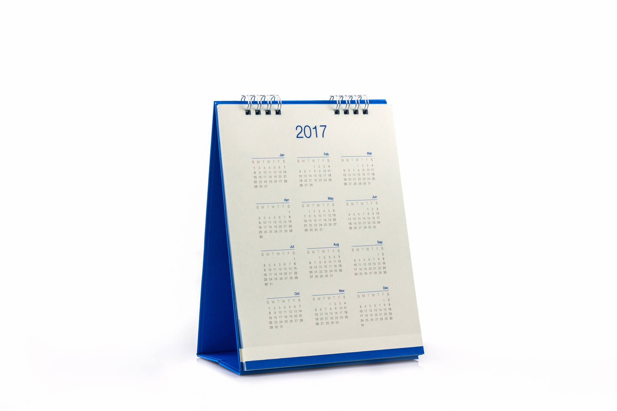 White paper desk spiral calendar 2017 on white background.
