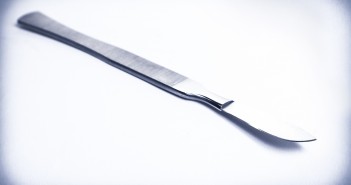 surgical scalpel on average light background