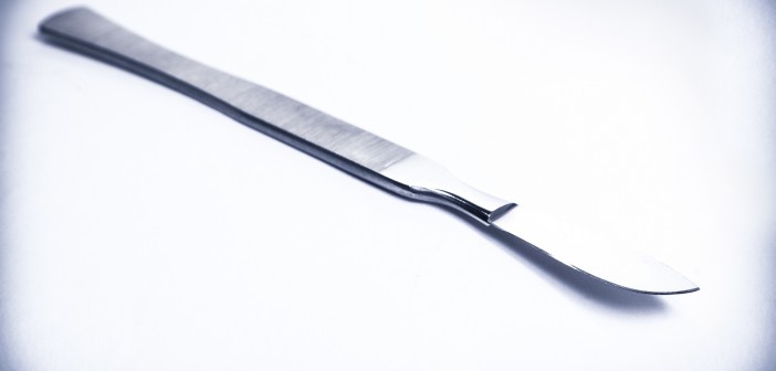 surgical scalpel on average light background